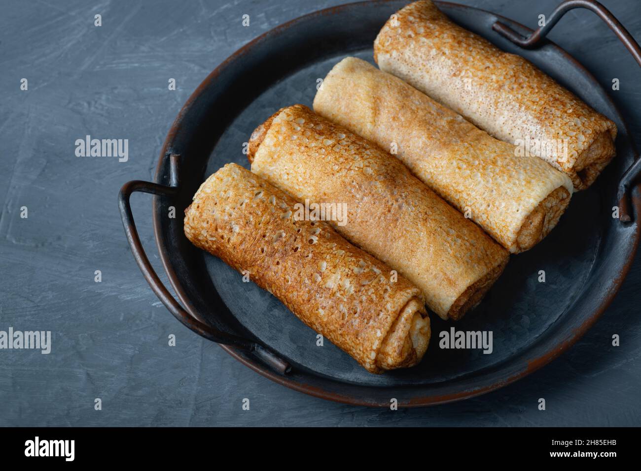 Thin pancakes or crepes stuffed with cottage cheese Stock Photo Alamy