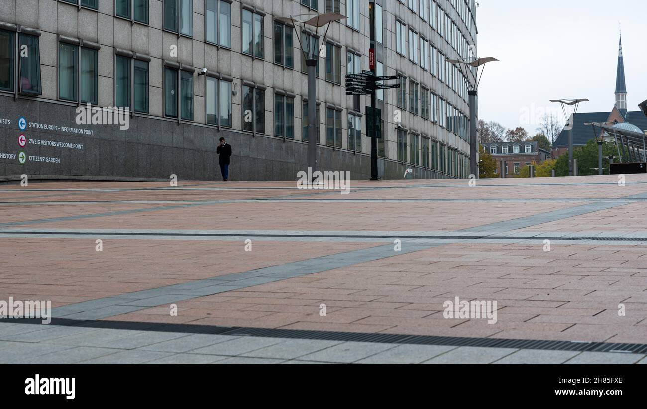 Ixelles, Brussels Capital Region, Belgium - 11 19 2021: Security agent walking on the esplanade of the European Parliament Stock Photo