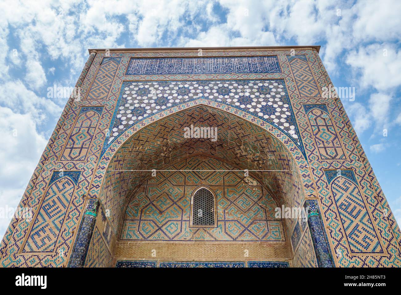 Portal of Kok-Gumbaz mosque or Blue Dome in translation, Shakhrisabz, Uzbekistan. Traditional ornaments decorate the building from top to bottom Stock Photo