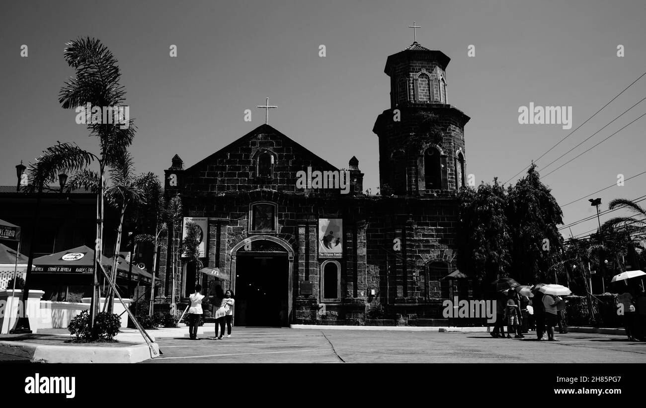LAGUNA, PHILIPPINES - Mar 24, 2016: A grayscale shot of the facade of an old church. Laguna, Philippines Stock Photo