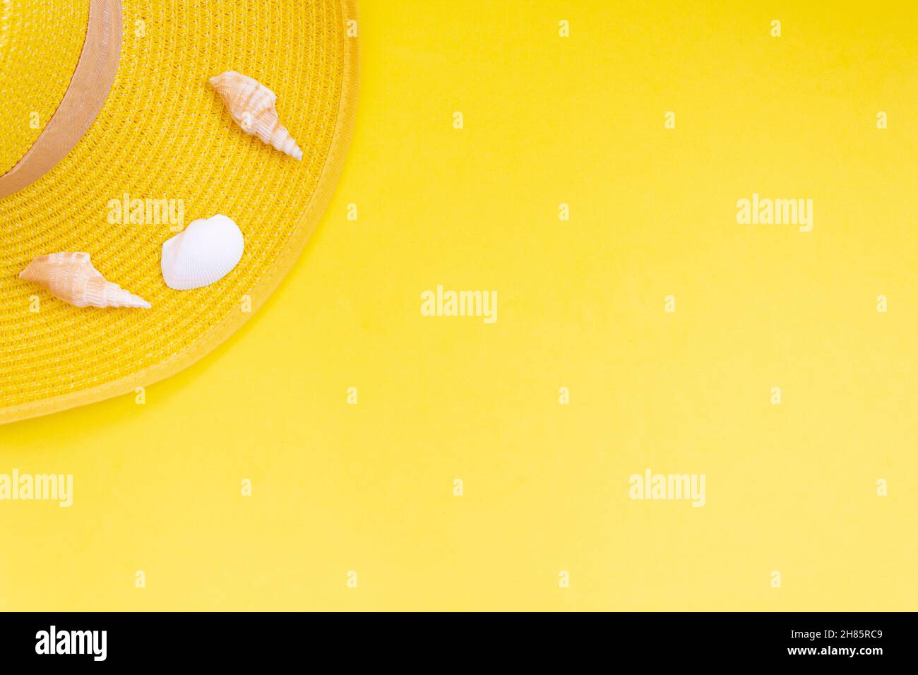 Yellow summer hat on yellow background. Summer concept. Top view with ...