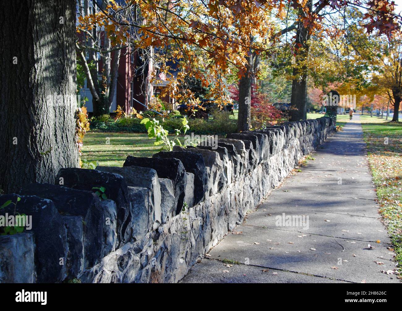 Old stonewall of old house along sidewalk on Lake Avenue in Lakewood