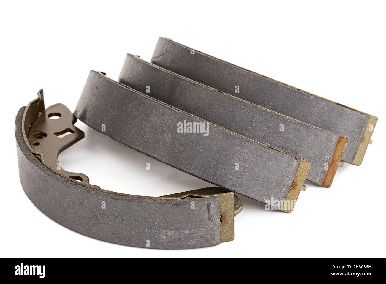 Set of asbestos brake pads, replacement spare parts of the car brake system, isolated on white