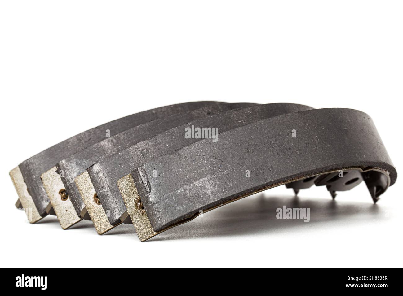 Set of asbestos brake pads, replacement spare parts of the car brake system, isolated on white