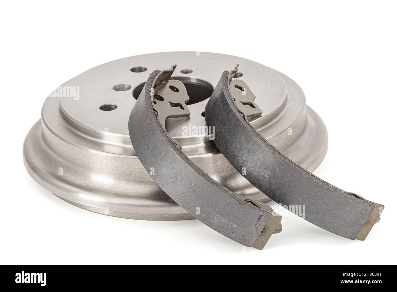 Asbestos brake pads and drum, replacement spare parts of the car brake system, isolated on white
