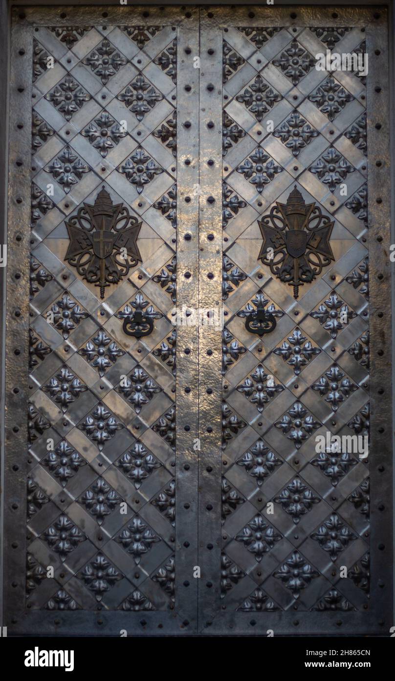Iron metal forged door on the street Stock Photo
