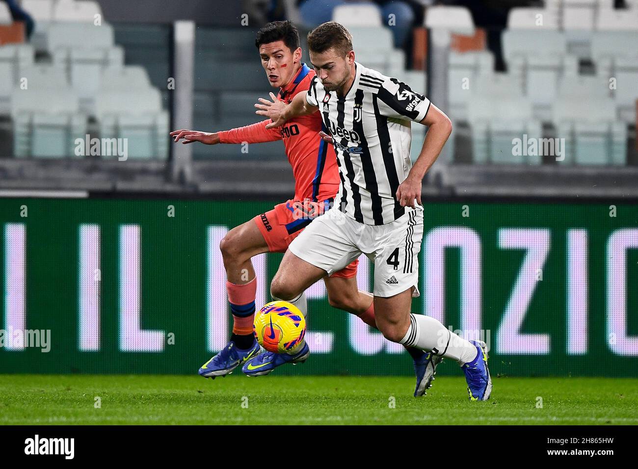 Turin, Italy. 27 November 2021. Matthijs de Ligt of Juventus FC is challenged by Matteo Pessina of Atalanta BC during the Serie A football match between Juventus FC and Atalanta BC. Credit: Nicolò Campo/Alamy Live News Stock Photo