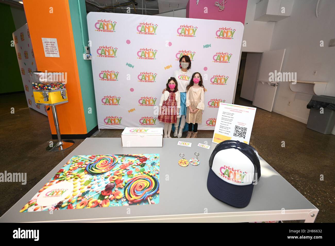 New York, USA. 27th Nov, 2021. Chef Cricket Azima (c) helps five year