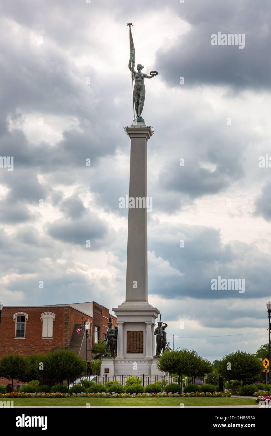 The Steuben County Soldiers' Monument stands tall under the clouds in downtown Angola, Indiana, USA. Stock Photo