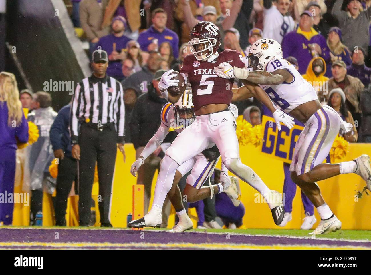 Baton Rouge, LA, USA. 27th Nov, 2021. Texas A&M's Jalen Preston #5 fights off LSU's Damone Clark #18 to score a touchdown during the NCAA football game between the LSU Tigers and the Texas A&M Aggies at Tiger Stadium in Baton Rouge, LA. Kyle Okita/CSM/Alamy Live News Stock Photo