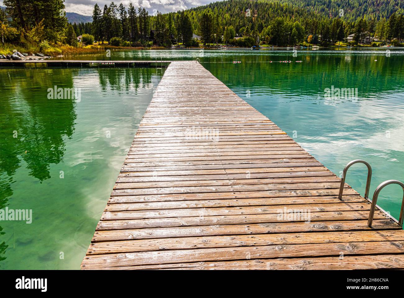 Fishing Pier Extending Onto Foys Lake, Kalispell, Montana, USA Stock Photo