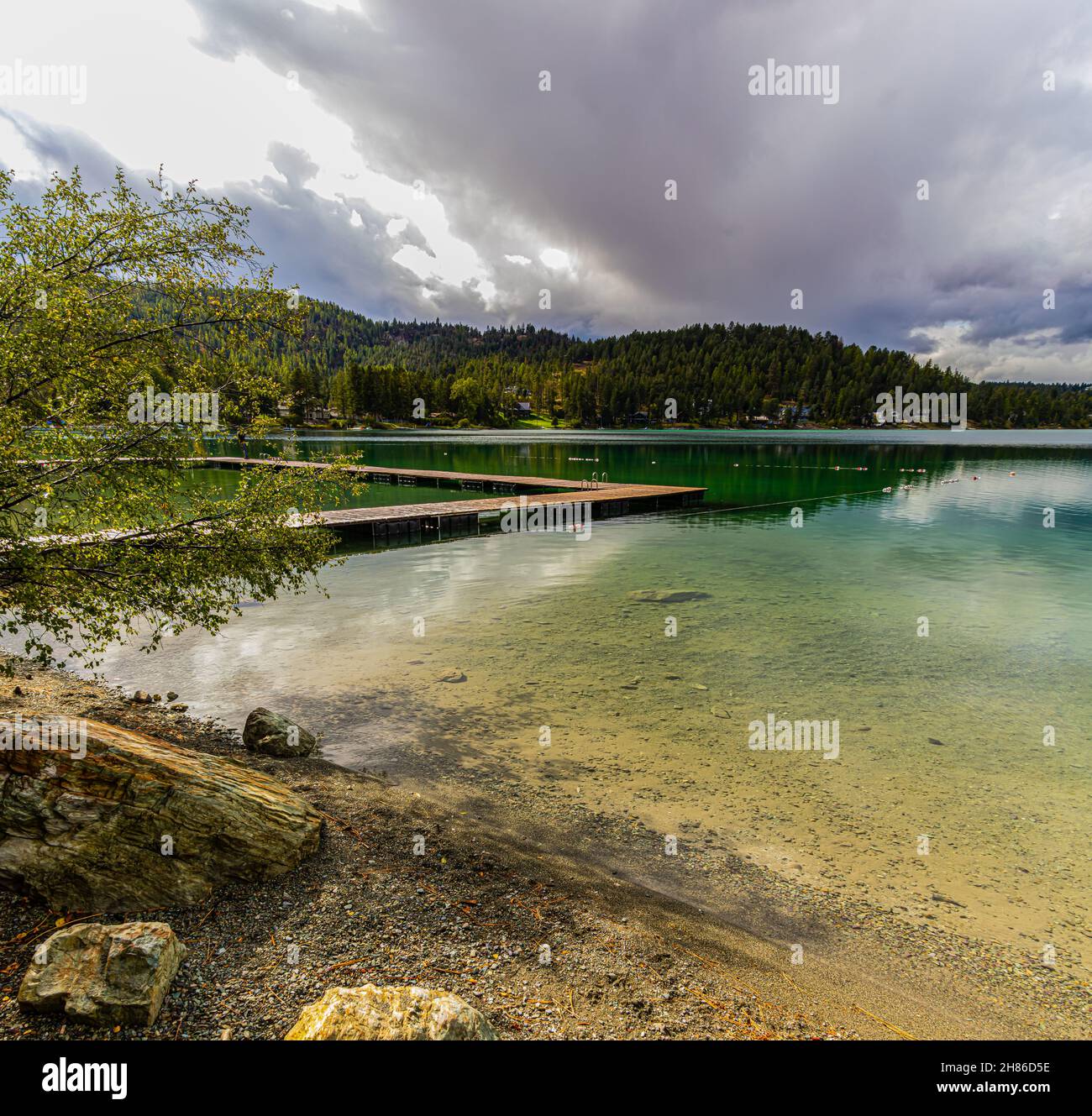 Fishing Pier Extending Onto Foys Lake, Kalispell, Montana, USA Stock Photo