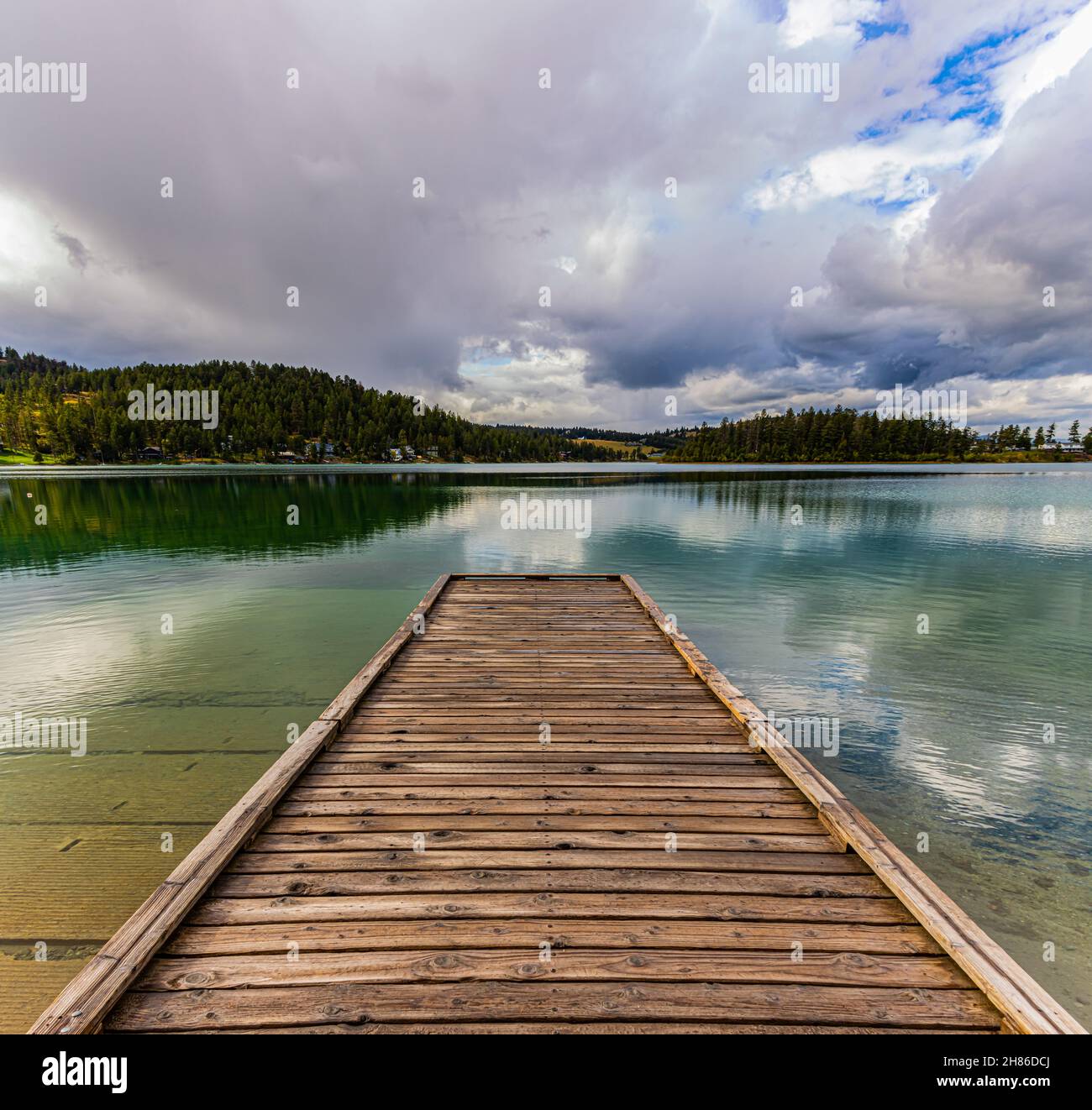 Fishing Pier Extending Onto Foys Lake, Kalispell, Montana, USA Stock Photo