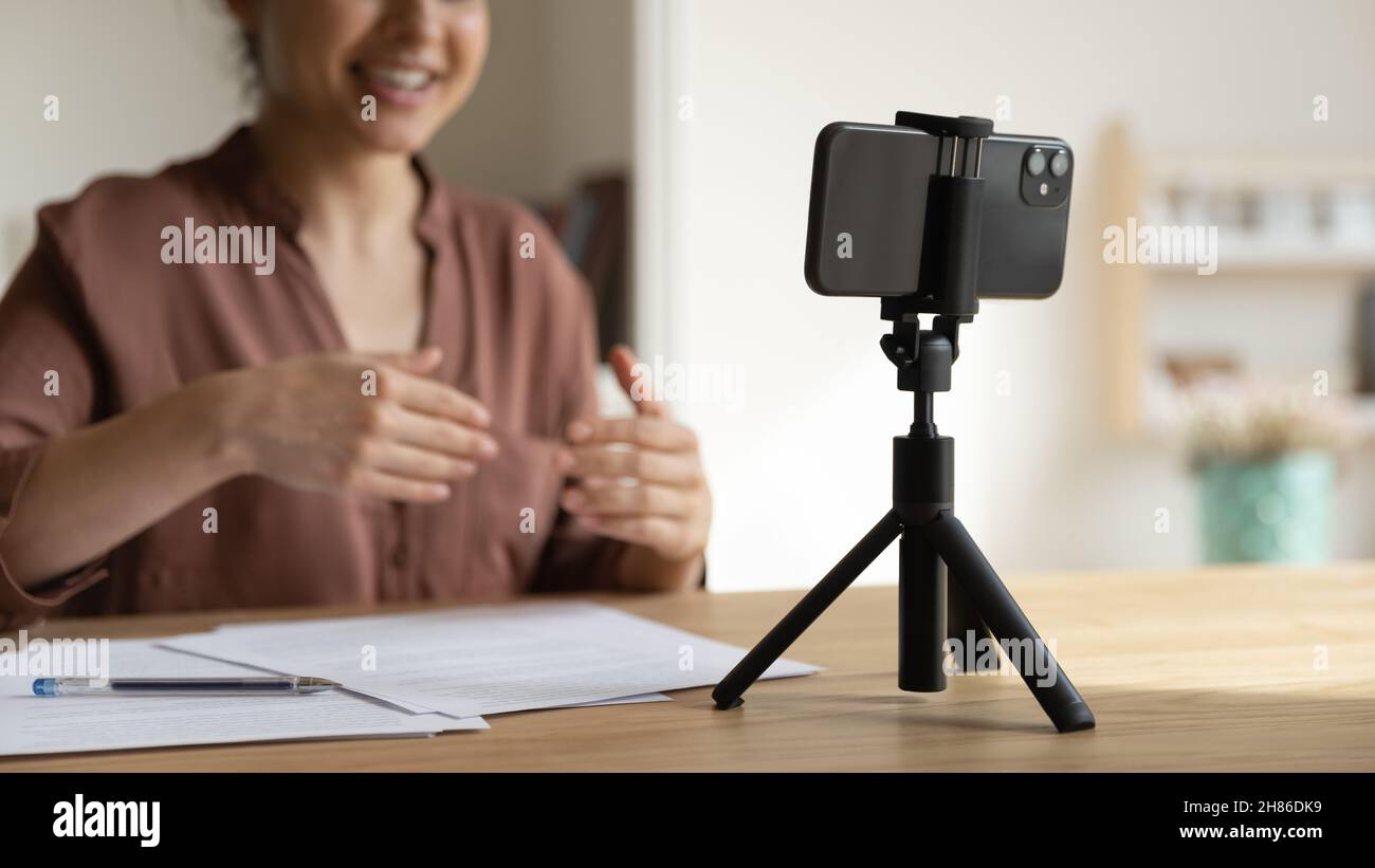 Young indian female blogger recording video on cellphone. Stock Photo