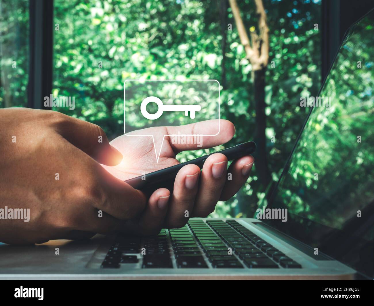 Two steps authentication concept. Virtual key icon on smartphone while ...