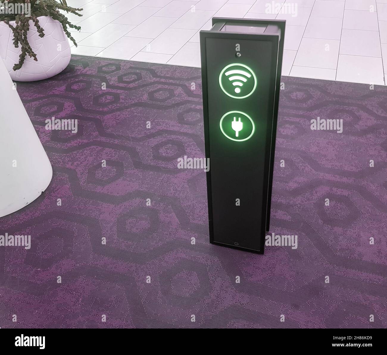 Close-up of a phone charging stand via usb and a Wi-Fi zone at the airport or supermarket. Stock Photo