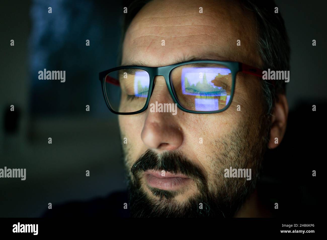 Crypto trader investor analyst looking at computer screen analyzing financial graph data on pc monitor, thinking of online stock exchange market Stock Photo