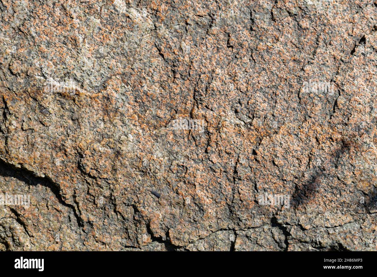 Cracked granite stone texture. Granite rock surface. Natural stone