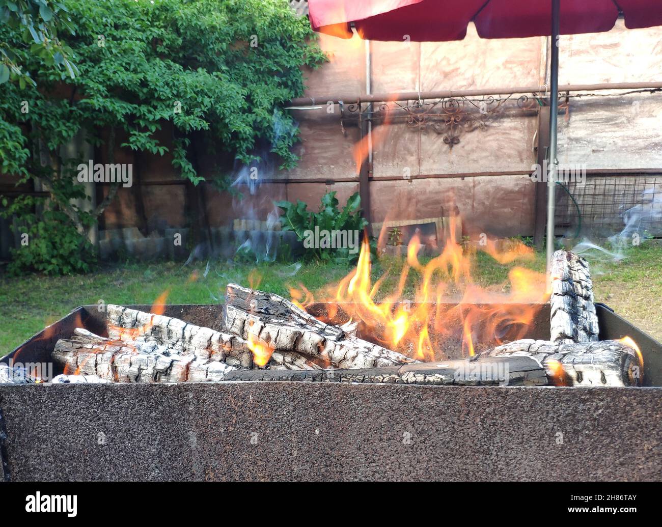 Barbeque fire background, preparing for a party. Vacation photo with ...