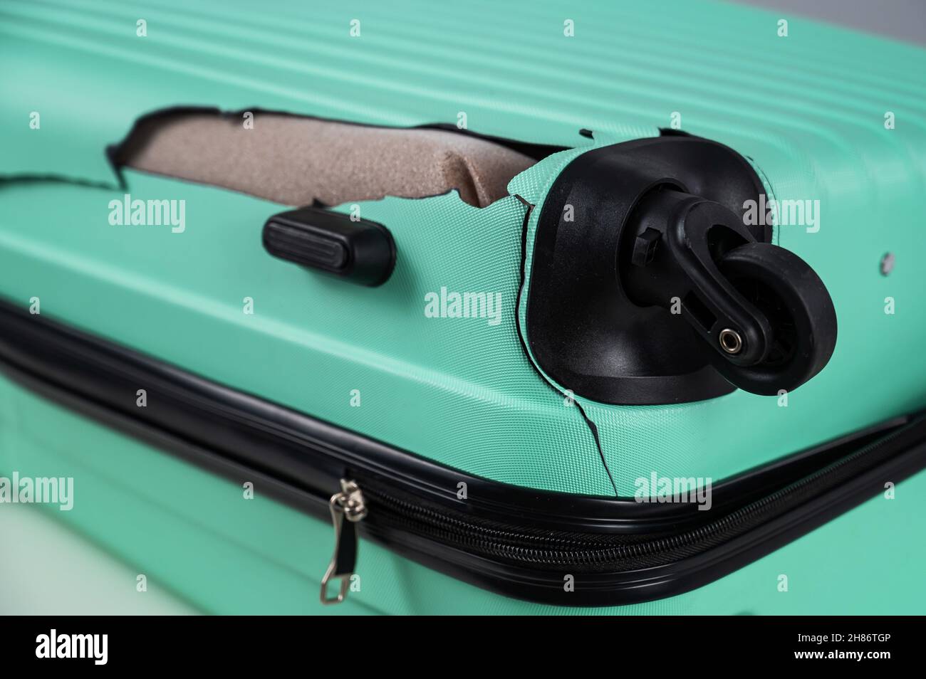 A closeup of a broken plastic suitcase Stock Photo Alamy