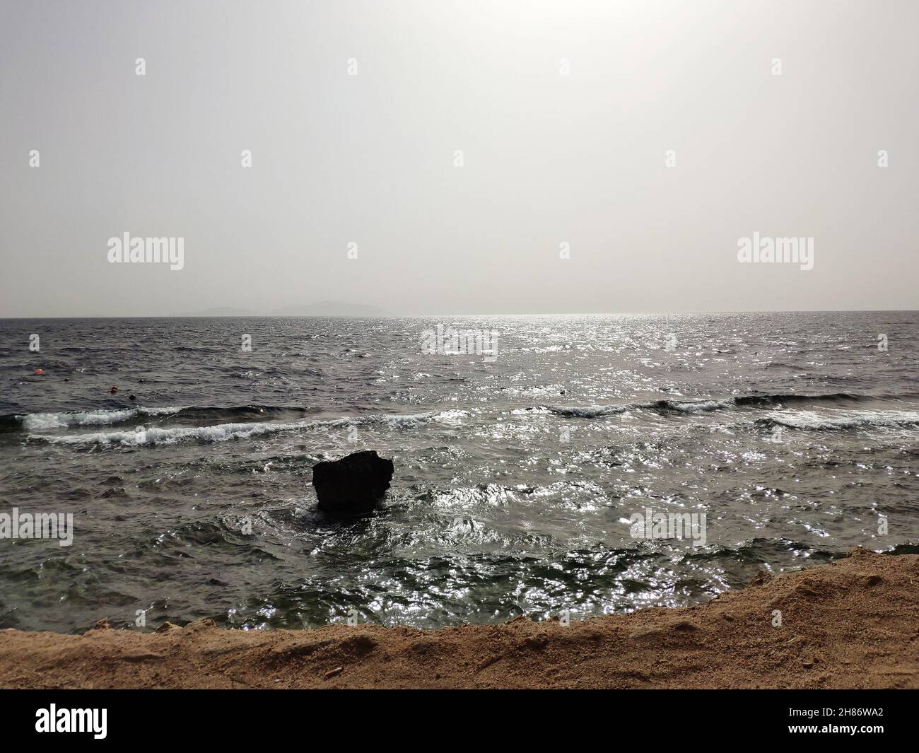 Red sea lit by summer sun of Egypt, seascape background in front light Stock Photo