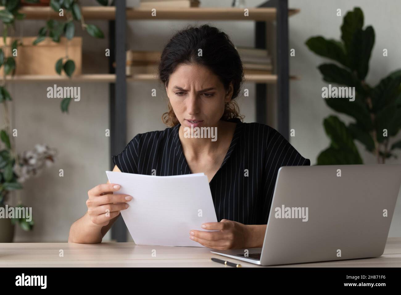Worried Unhappy Latin Businesswoman Read Paper Letter About Credit Denial Stock Photo Alamy