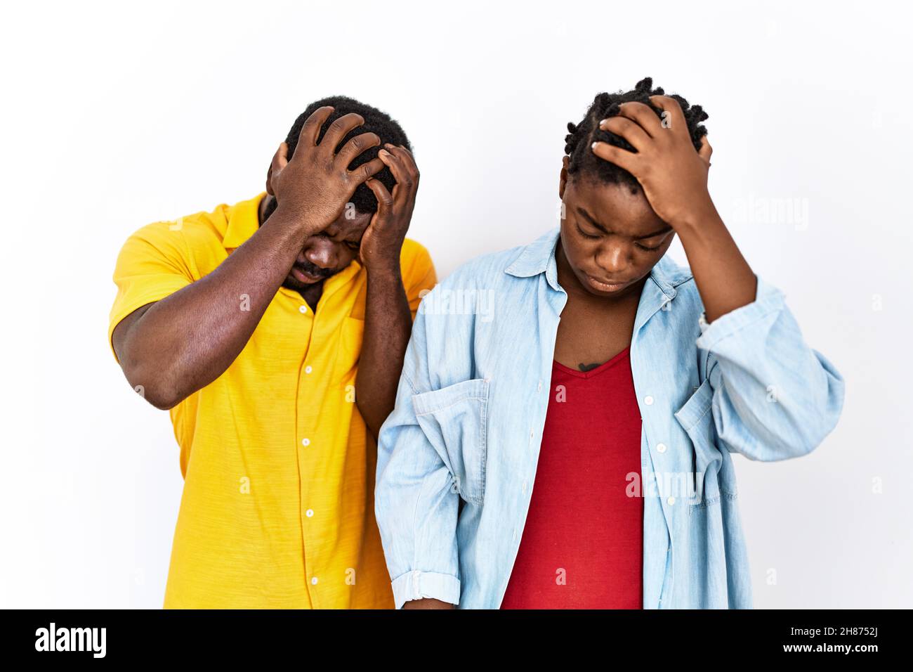 Young african american couple wearing casual clothes suffering from ...
