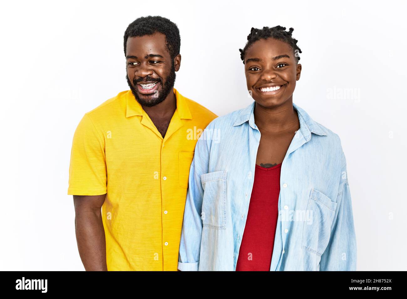 Young african american couple wearing casual clothes with a happy and ...