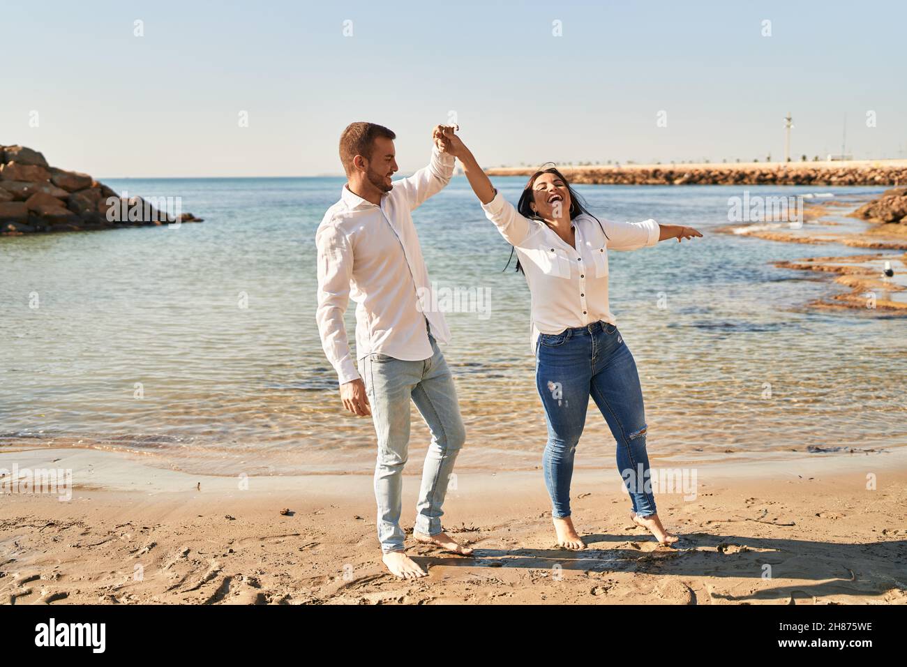 Happy woman dancing seaside hi-res stock photography and images - Alamy