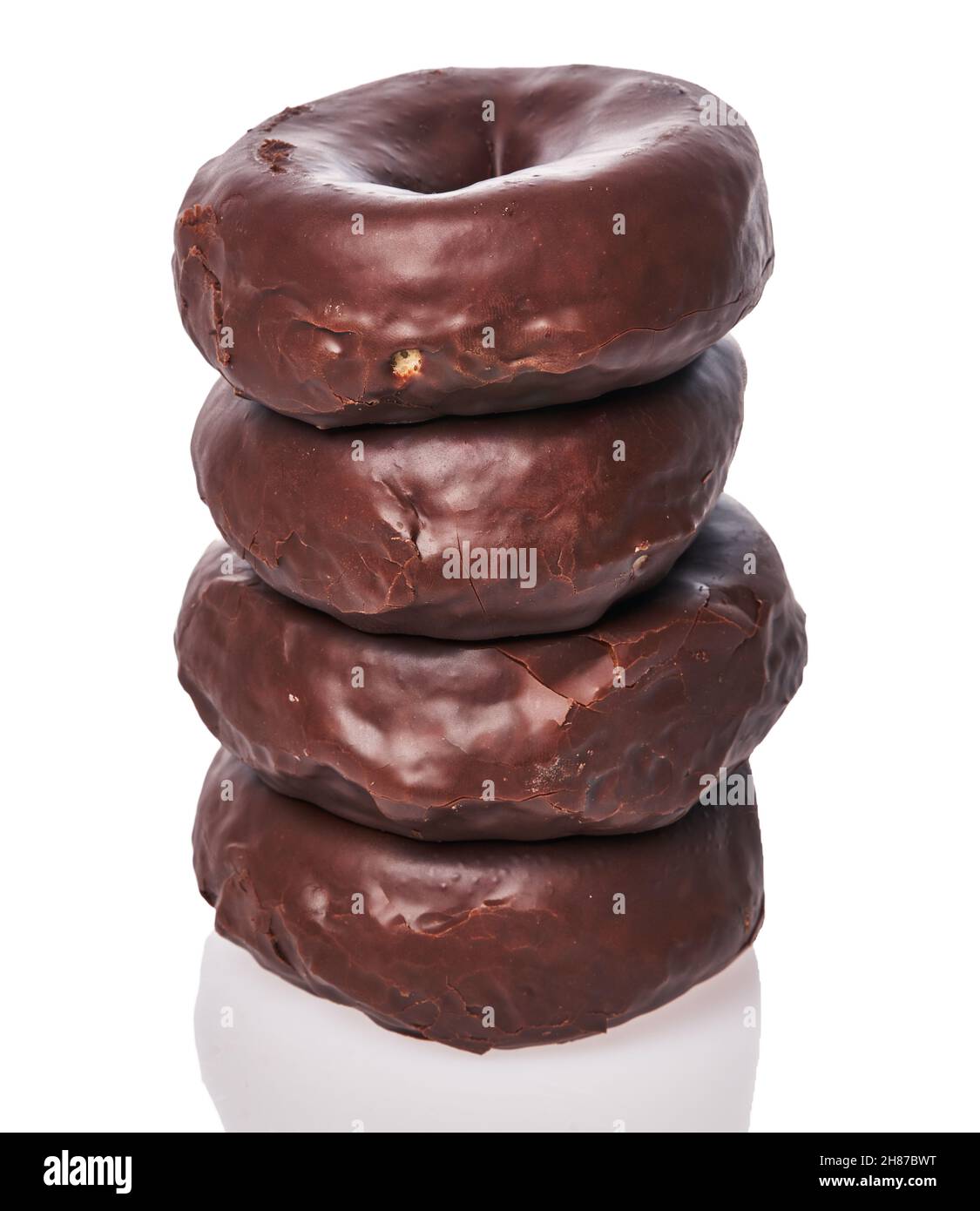Stack of chocolate doughnuts isolated on a white background Stock Photo ...
