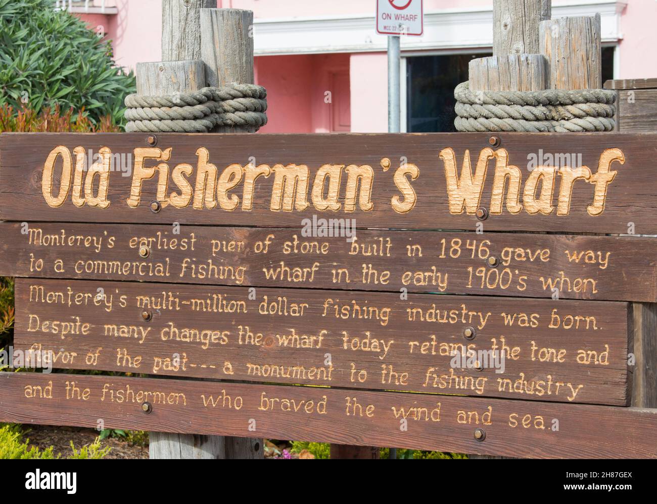 Monterey, California, USA. Simple wooden sign marking entrance to the historic Old Fisherman's Wharf. Stock Photo