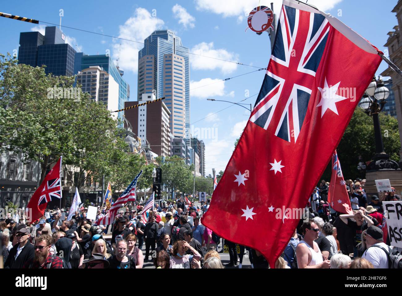 27th November 2021. A red 'Q' for conspiracy theory Qanon sits above the Australian flag. Melbourne, Australia.  Credit: Jay Kogler/Alamy Live News Stock Photo