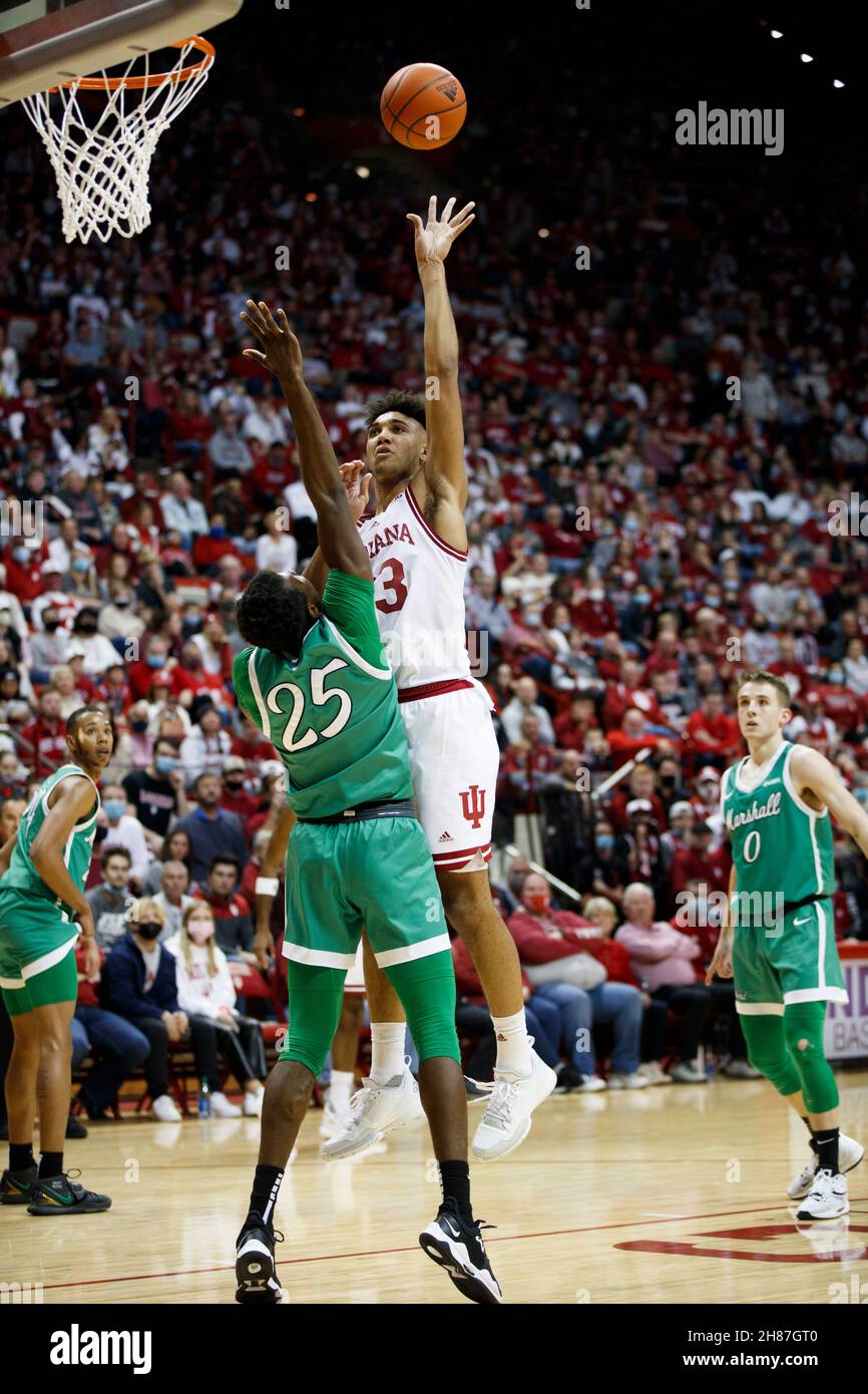 Bloomington, United States. 27th Nov, 2021. Indiana Hoosiers forward Trayce Jackson-Davis (23) goes to the basket against Marshall Thundering Herd forward Obinna Anochili-Killen (25) during an NCAA basketball game in Bloomington, Ind. IU beat Marshall 90-79. Credit: SOPA Images Limited/Alamy Live News Stock Photo