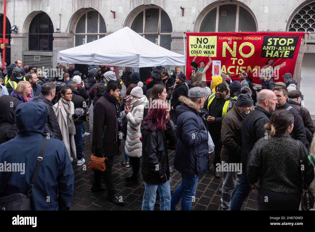 London, UK. 27th Nov, 2021. Protesters seen gathering during the rally.'Anti-Asian Hate' rally organized by Pro-Beijing protesters and 'Lunch with you' rally organized by Hong Kong democracy protesters, separately gather at the same spot in Chinatown in London. While Pro-Beijing group shouting No Anti-Asian Hate, Hongkongers came back with Resist Chinese Communist Party (CCP) and No to Genocide. Credit: SOPA Images Limited/Alamy Live News Stock Photo