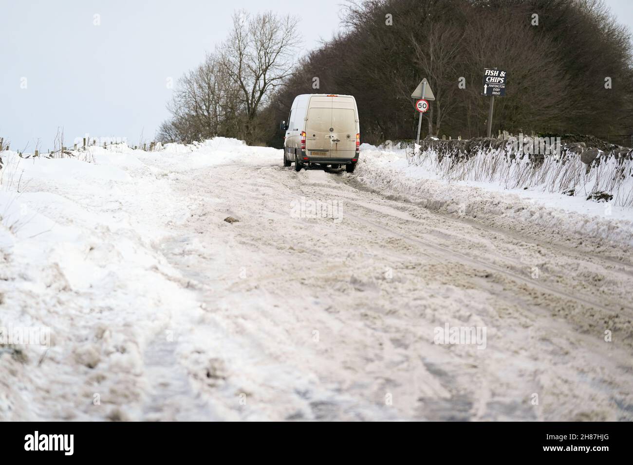 A van is stuck attempting to travel along the snow-covered A515 near Biggin, in the Peak District, Derbyshire, amid freezing conditions in the aftermath of Storm Arwen. Picture date: Sunday November 28, 2021. Stock Photo