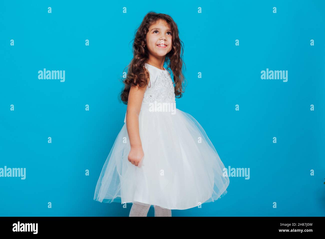 beautiful little girl in white dress as princess queen Stock Photo - Alamy