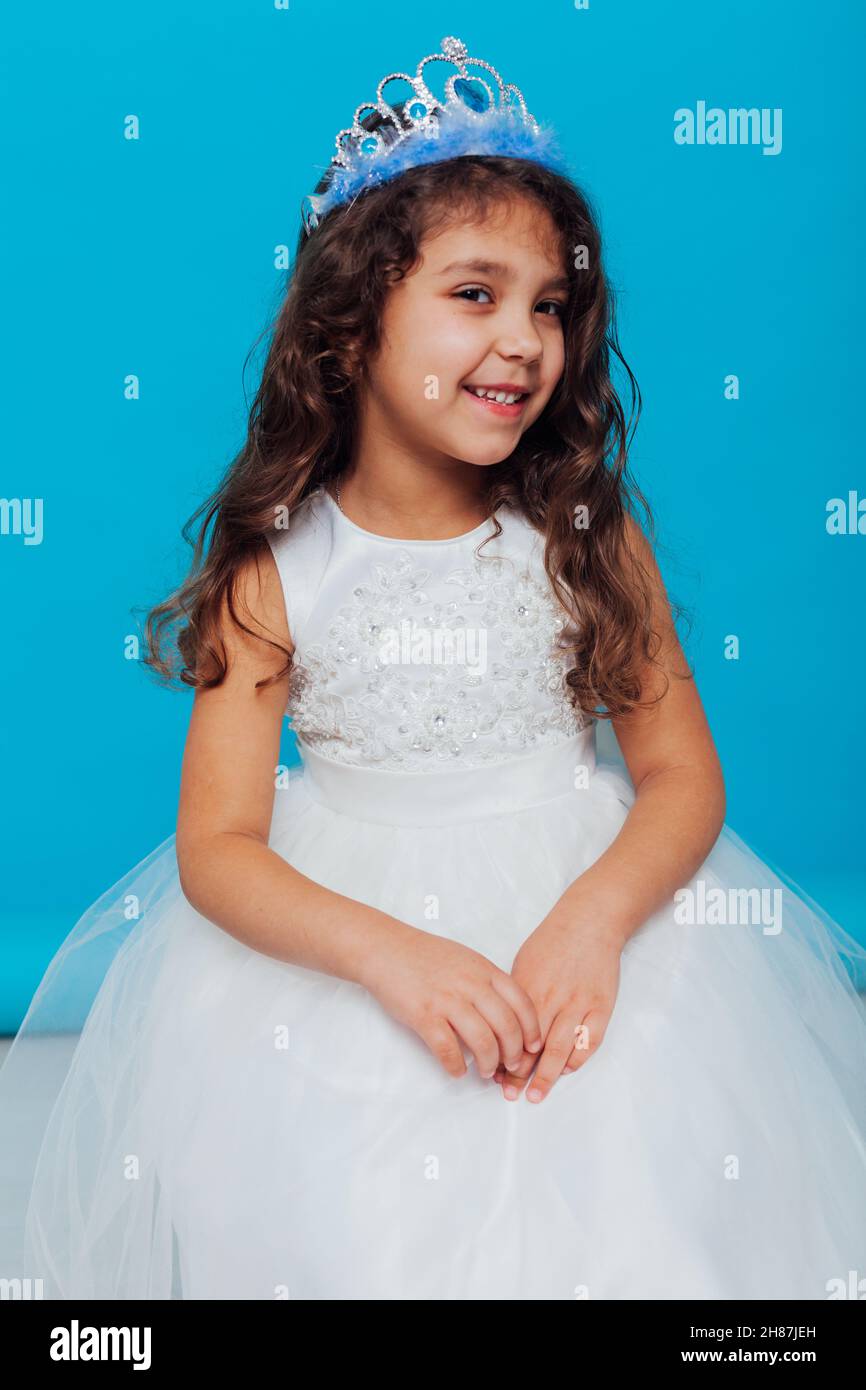 beautiful little girl in white dress as princess queen Stock Photo Alamy
