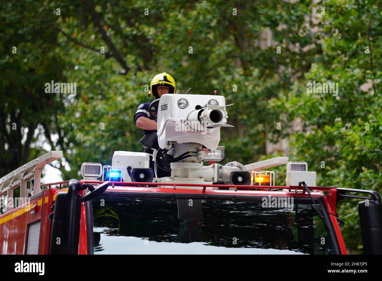 French firefighter on airport truck during Bastille day parade Stock Photo