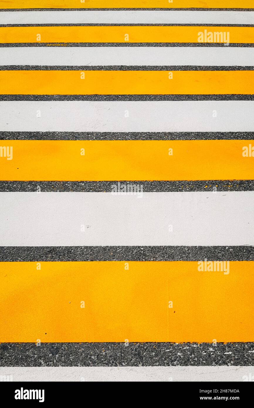 road marking White and yellow pedestrian crossing. Modern yellow and