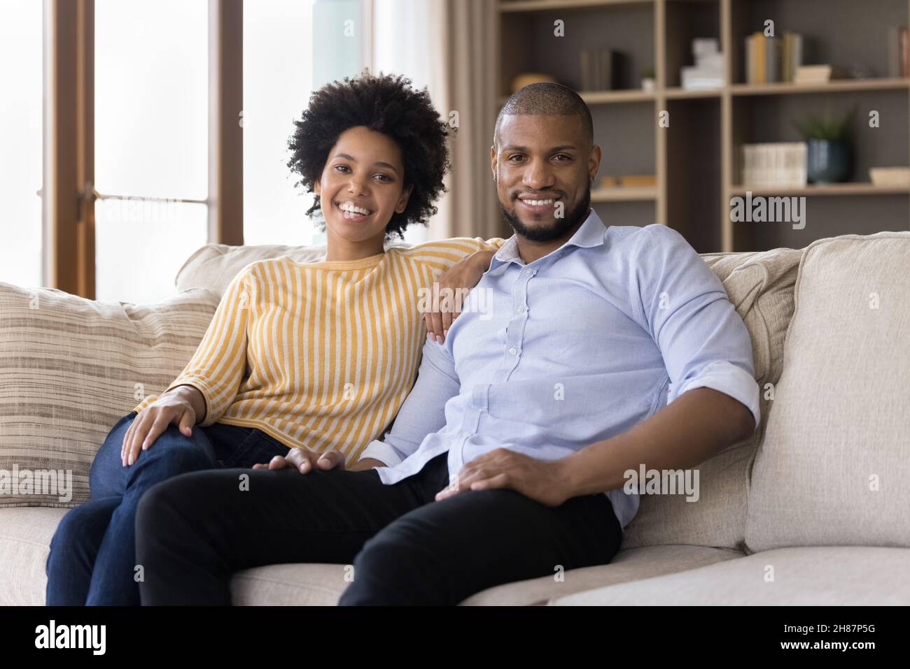 Happy millennial African American couple of homeowners Stock Photo