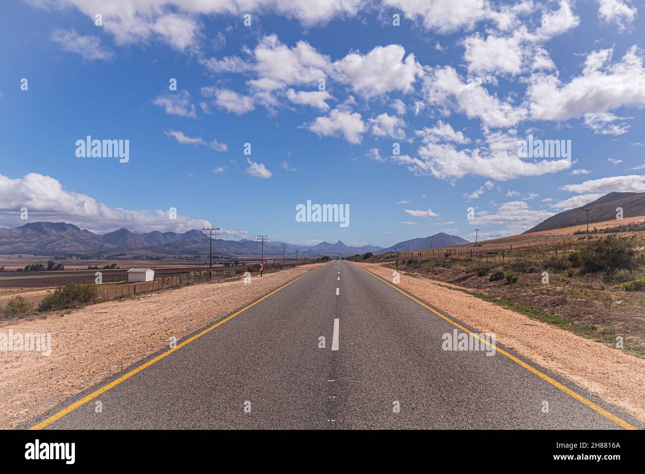 The road of Route 62 through Karoo landscape in South Africa. Stock Photo