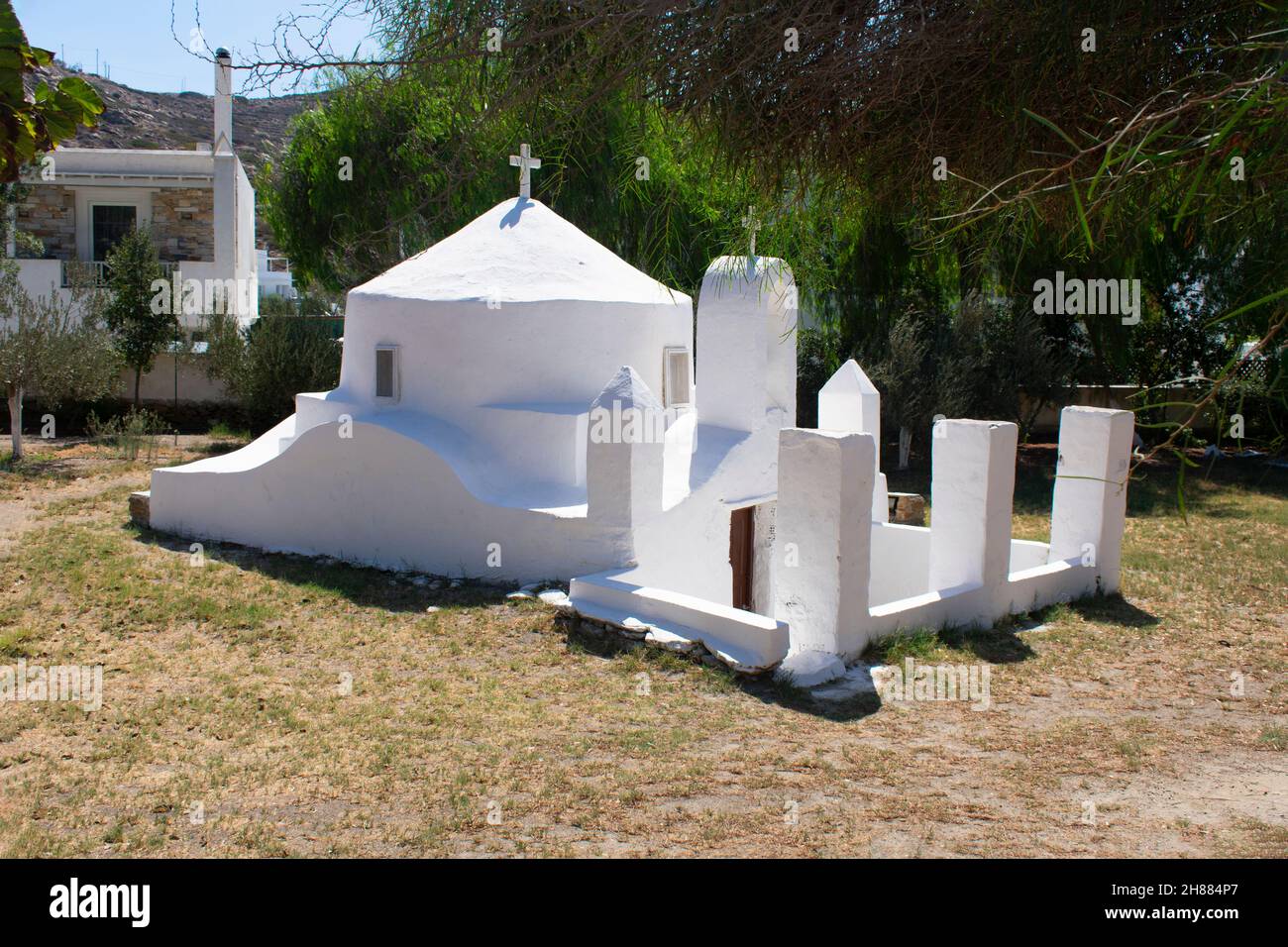 Beautiful Ios Island Greece. Picturesque small secluded chapel at this holiday destination. Landscape aspect view. Stock Photo