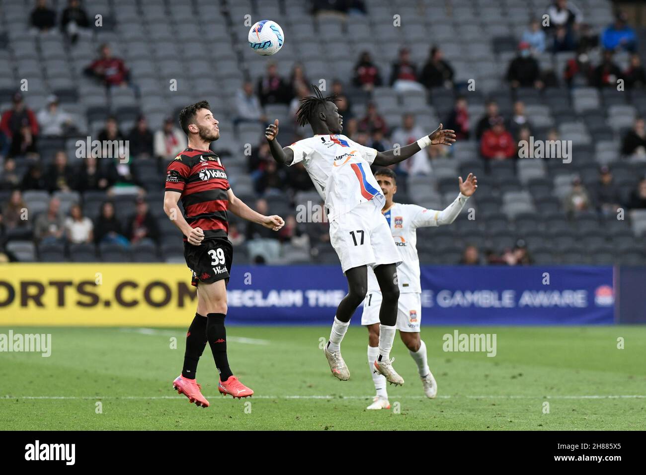 28th November 2021;  CommBank Stadium, Parramatta, Western Sydney, Australia ; Australian A-League football, Western Sydney Wanderers versus Newcastle Jets; Thomas Aquilina of Western Sydney Wanderers wins a header against Valentino Yuel of Newcastle Jets Stock Photo