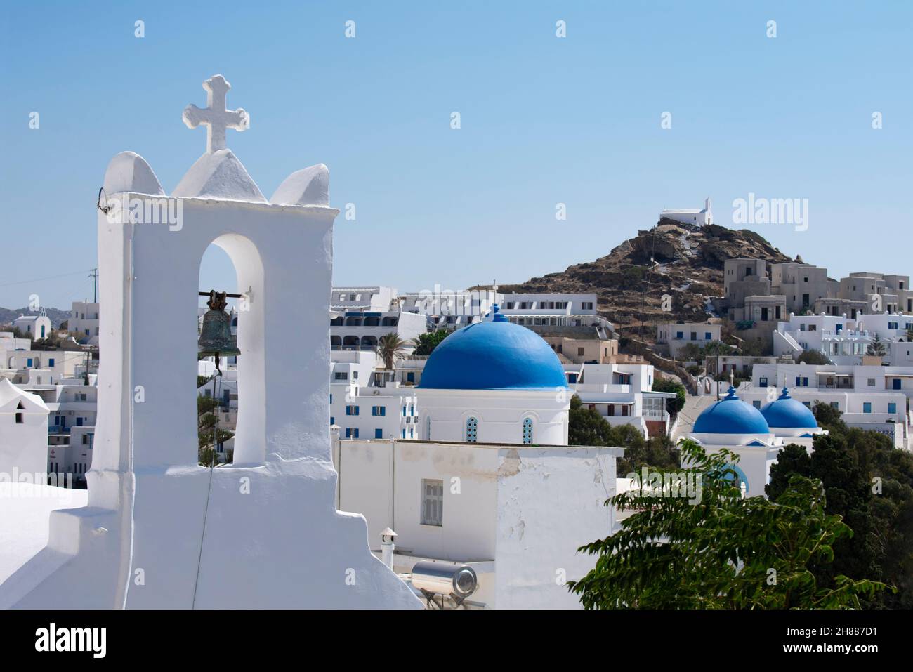 Beautiful Ios Island Greece. Charming old village with view of traditional old churches and chapels.  Landscape aspect view with copy space. Stock Photo