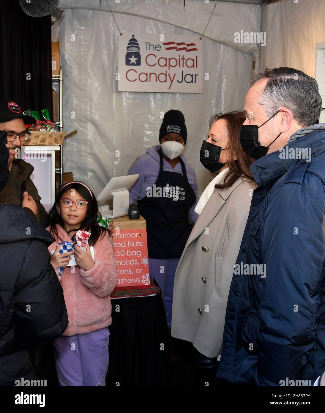 United States Vice President Kamala Harris (C) and second gentleman Douglas Emhoff (R)  support Small Business Saturday with a visit to DC’s Downtown Holiday Market, Saturday, November 27, 2021, in Washington, DC.        Credit: Mike Theiler / Pool via CNP /MediaPunch Stock Photo