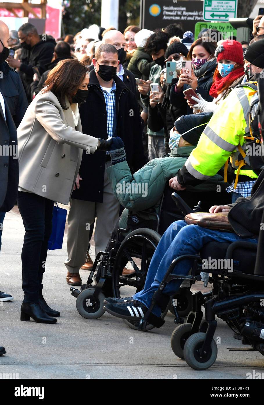 United States Vice President Kamala Harris (L) greets shoppers as she supports Small Business Saturday with a visit to DC’s Downtown Holiday Market, Saturday, November 27, 2021, in Washington, DC.Credit: Mike Theiler / Pool via CNP /MediaPunch Stock Photo