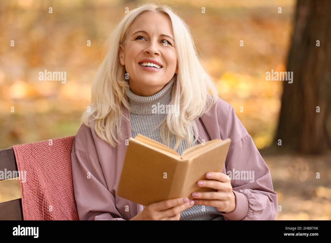 Woman read autumn portrait mature hi-res stock photography and images ...