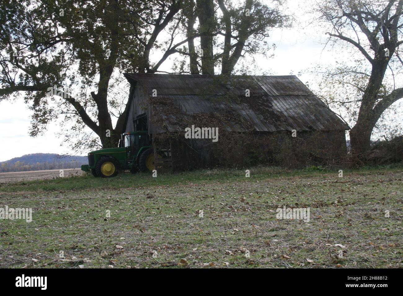 John Deere tractor in an Old Missouri Barn Stock Photo Alamy