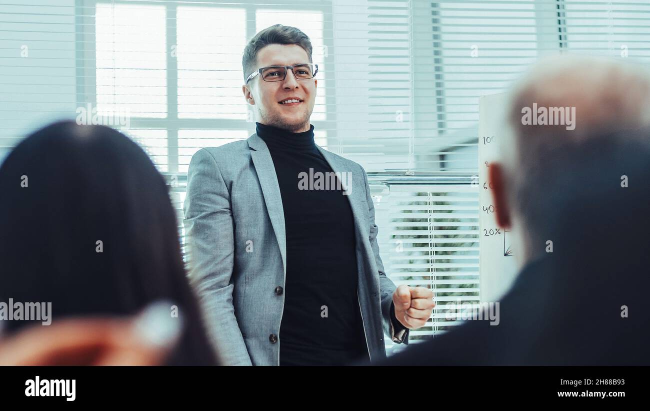 project Manager making a report for the working group Stock Photo