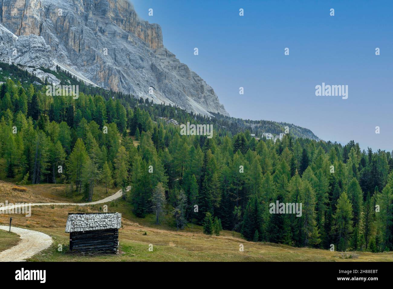 The Santa Croce Sanctuary in Alta Badia overlooking the mountains of Fanes – Senes – Braies Nature Park in the italian Dolomites Stock Photo